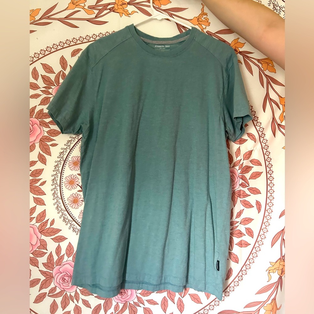 A men’s blue, size large, Kenneth Cole shirt. Worn only once.